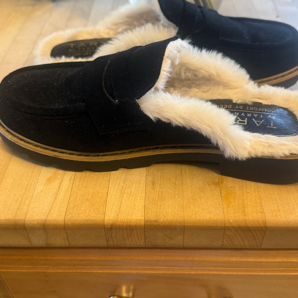 Taryn Rose black mules with lined faux fur